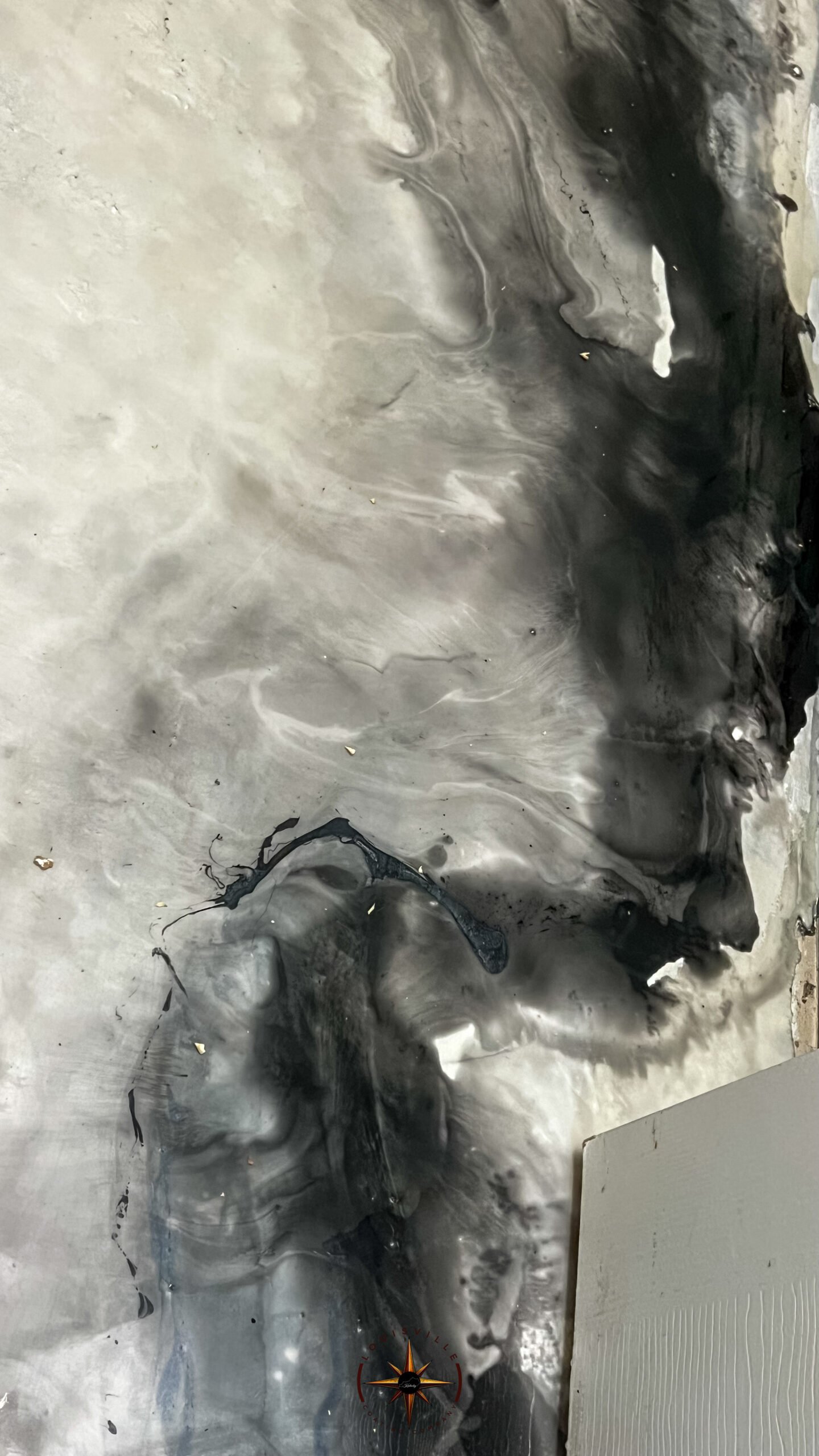 Close View Of A Black White And Silver Metallic Epoxy Floor